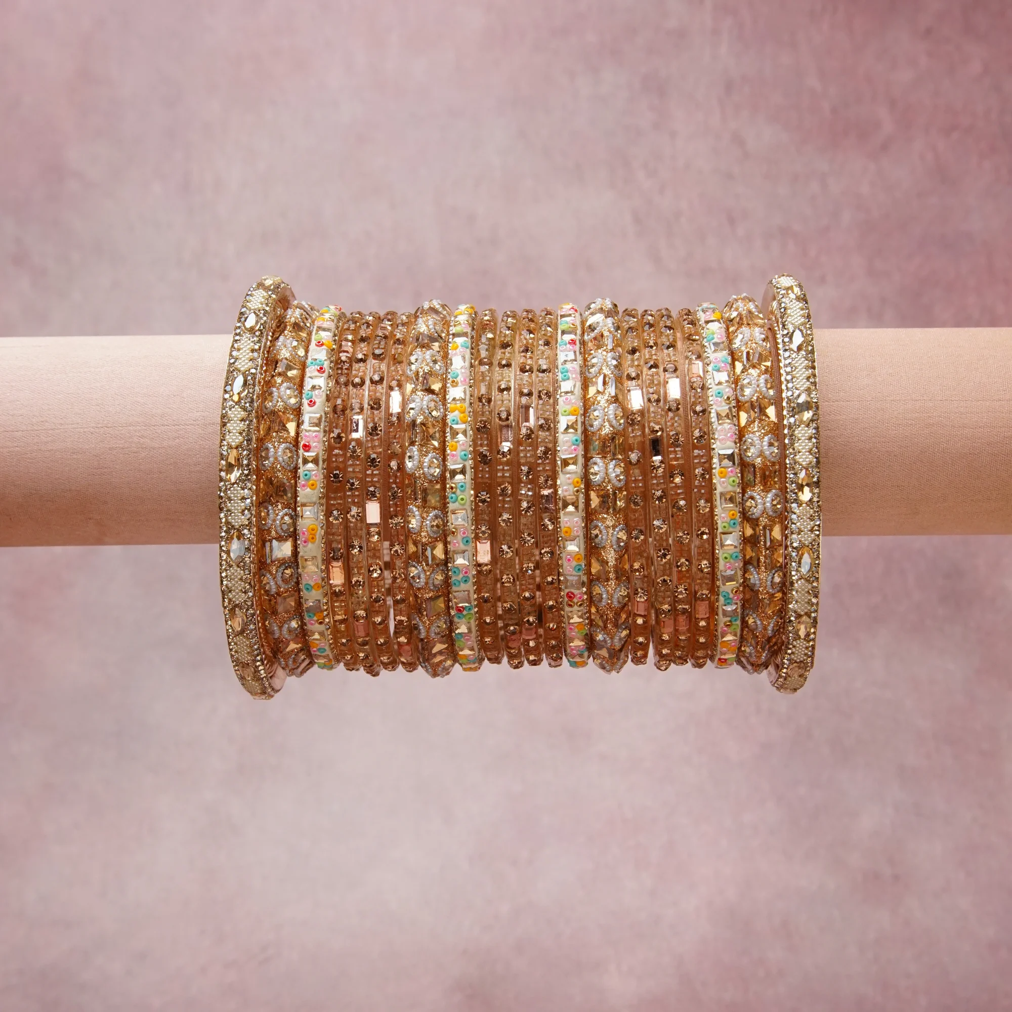 A grounding Gold forms the heart of the set, while touches of Clear, Pastel Pink, Pastel Blue, Pastel Green, Pastel Peach add charm.

A thoughtful composition of Gold-toned Metal, Glass, Crystal, Colored Glass/Resin, designed to feel complete without being heavy.
Each element layers seamlessly, creating a look that is refined, wearable and quietly striking.